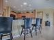 Kitchen with breakfast bar and modern appliances at 8913 Se 132Nd Loop, Summerfield, FL 34491