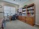 Home office with built-in bookcases and a work desk at 8913 Se 132Nd Loop, Summerfield, FL 34491