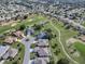 Houses surrounding a golf course, aerial view at 8913 Se 132Nd Loop, Summerfield, FL 34491
