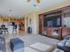 Spacious living area with kitchen views and built-in entertainment center at 8913 Se 132Nd Loop, Summerfield, FL 34491
