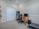 Home office with a large desk and a treadmill at 8913 Se 132Nd Loop, Summerfield, FL 34491