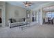 Open living room with ample natural light and view to dining area at 8913 Se 132Nd Loop, Summerfield, FL 34491