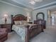 Spacious main bedroom with king-size bed and ensuite bathroom at 8913 Se 132Nd Loop, Summerfield, FL 34491