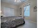 Bedroom with a queen-size bed and large closet at 8913 Se 132Nd Loop, Summerfield, FL 34491