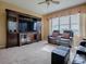Home theater entertainment center with large TV and ample storage at 8913 Se 132Nd Loop, Summerfield, FL 34491