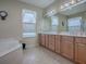 Double vanity bathroom with soaking tub and shower at 8913 Se 132Nd Loop, Summerfield, FL 34491