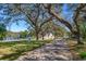 Brick driveway with view of lake and trees at 10529 N Crescent Ln, Clermont, FL 34711