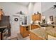 Granite countertops and wood cabinets in this kitchen at 1720 Park Forest Blvd, Mount Dora, FL 32757