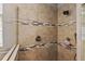 Walk-in shower with tile surround and multiple shower heads at 1720 Park Forest Blvd, Mount Dora, FL 32757