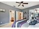 Bedroom with queen bed and access to bathroom and lanai at 1720 Park Forest Blvd, Mount Dora, FL 32757