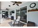 Relaxing patio with rocking chairs and ceiling fans at 1720 Park Forest Blvd, Mount Dora, FL 32757