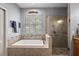 Bathroom with soaking tub and walk-in shower, double vanity at 1720 Park Forest Blvd, Mount Dora, FL 32757