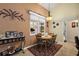 Bright breakfast nook with a round table and four chairs, adjacent to kitchen at 1720 Park Forest Blvd, Mount Dora, FL 32757
