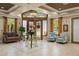 Elegant community lobby with seating area and large windows at 1720 Park Forest Blvd, Mount Dora, FL 32757