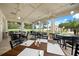 Screened-in patio dining area with scenic views at 1720 Park Forest Blvd, Mount Dora, FL 32757