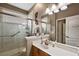 Bathroom features a walk-in shower and updated vanity at 1720 Park Forest Blvd, Mount Dora, FL 32757