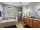Bathroom boasts a soaking tub, walk-in shower, and double vanity at 1720 Park Forest Blvd, Mount Dora, FL 32757