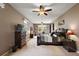 Spacious main bedroom with a king-size bed and private access to the lanai at 1720 Park Forest Blvd, Mount Dora, FL 32757
