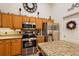 Stainless steel appliances and granite countertops in kitchen at 1720 Park Forest Blvd, Mount Dora, FL 32757