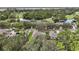 Aerial view of homes, golf course, and lake at 1720 Park Forest Blvd, Mount Dora, FL 32757