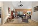 Spacious living room with vaulted ceiling, sectional sofa, and built-in entertainment center at 1720 Park Forest Blvd, Mount Dora, FL 32757