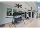 Covered patio with ceiling fans and comfortable seating at 1720 Park Forest Blvd, Mount Dora, FL 32757