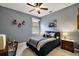 Cozy bedroom with a queen-size bed and window seat at 1720 Park Forest Blvd, Mount Dora, FL 32757