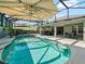 Stunning pool with a screened enclosure and patio at 3371 Mccabe St, The Villages, FL 32163