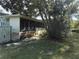 Back exterior of house with screened porch at 405 N Rhodes St, Mount Dora, FL 32757