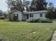 Charming one-story home with well-maintained lawn at 405 N Rhodes St, Mount Dora, FL 32757