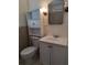 Clean bathroom featuring a toilet, sink, and vanity at 405 N Rhodes St, Mount Dora, FL 32757