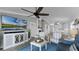 Living room with open floor plan, view to kitchen, and ceiling fan at 450 Bouchelle Dr # 301, New Smyrna Beach, FL 32169
