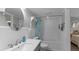 Clean bathroom with tub, shower, and white subway tile at 450 Bouchelle Dr # 301, New Smyrna Beach, FL 32169