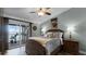 Peaceful main bedroom with water view and sliding glass doors to balcony at 450 Bouchelle Dr # 301, New Smyrna Beach, FL 32169