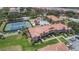 Aerial view of community amenities including tennis courts and pool at 450 Bouchelle Dr # 301, New Smyrna Beach, FL 32169