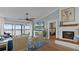 Bright living room with fireplace and water views at 450 Bouchelle Dr # 301, New Smyrna Beach, FL 32169
