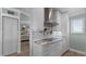 White shaker cabinets, stainless steel appliances and marble countertops at 450 Bouchelle Dr # 301, New Smyrna Beach, FL 32169