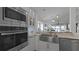 Modern kitchen with stainless steel appliances and marble countertops at 450 Bouchelle Dr # 301, New Smyrna Beach, FL 32169
