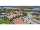 Community view with pool, tennis courts, and waterfront access at 450 Bouchelle Dr # 301, New Smyrna Beach, FL 32169