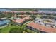 Community view with pool, tennis courts, and waterfront access at 450 Bouchelle Dr # 301, New Smyrna Beach, FL 32169