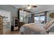 Bright bedroom with water view, king-size bed, and mirrored closet at 450 Bouchelle Dr # 301, New Smyrna Beach, FL 32169