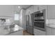 Modern kitchen with stainless steel appliances and marble countertops at 450 Bouchelle Dr # 301, New Smyrna Beach, FL 32169