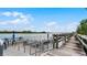 Wooden community dock with seating overlooking the water at 450 Bouchelle Dr # 301, New Smyrna Beach, FL 32169