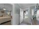 Bright entryway with wood floors, leading to bedroom and balcony at 450 Bouchelle Dr # 301, New Smyrna Beach, FL 32169