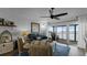 Cozy living room with water view, ceiling fan, and comfortable seating at 450 Bouchelle Dr # 301, New Smyrna Beach, FL 32169