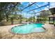 Inviting screened pool and patio area with water feature at 5084 Greens Dr, Lady Lake, FL 32159