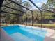 Large, refreshing pool with screened enclosure at 512 E Lakeshore Dr, Clermont, FL 34711