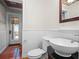 Stylish bathroom with pedestal sink and ocean view at 6118 Dora Dr, Mount Dora, FL 32757