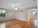 Large bedroom with hardwood floors and two windows at 6118 Dora Dr, Mount Dora, FL 32757