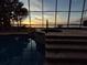 Enclosed pool and spa area with sunset lake views at 6118 Dora Dr, Mount Dora, FL 32757